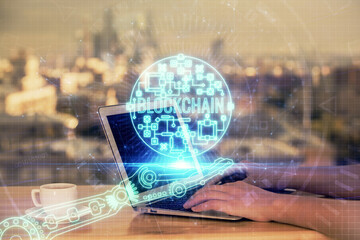 Double exposure of woman hands typing on computer and crypto market theme hologram drawing....