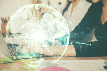Multi exposure of woman hands typing on computer and business theme hologram drawing. Success...
