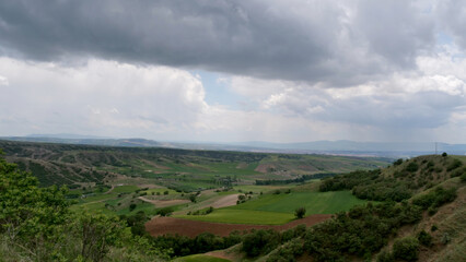 clouds and sky. beautiful view from the valley. Small towns and villages below