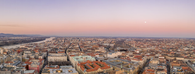 Panoramic aerial drone shot of downtown skyline in Budapest winter sunset hour
