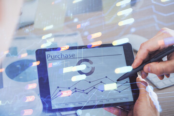 Multi exposure of man's hands holding and using a digital device and data theme drawing. Innovation concept.