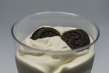 homemade dessert with milk cream and chocolate chip cookies and raspberry cream