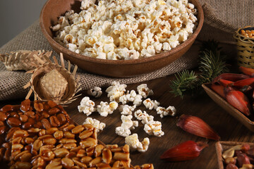 Food group from Festa Junina, a typical Brazilian party, holiday event in June: Pe de moleque, peanuts, cake, sweets, popcorn and pine nuts