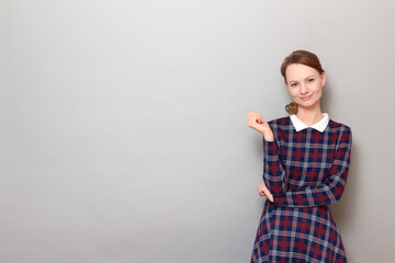 Portrait of cheerful young woman smiling and looking relaxed
