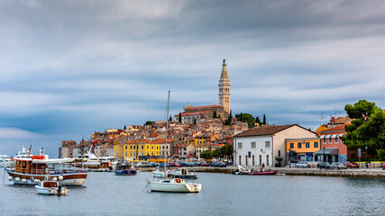 A pic of Rovinj on a cloudy day with boats in the water