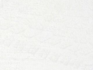 The surface of the white concrete wall.