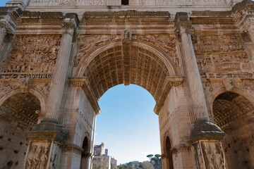 Fototapeta na wymiar Roman Forum. Rome, Italy. Ruins of the Triumphal Arch in Septimius Severus.