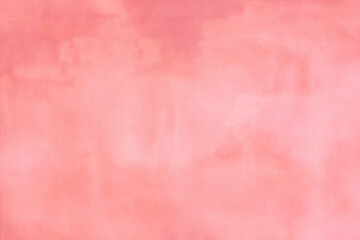 Rustic pink blush concrete cement wall with darker and lighter areas to use as a background or banner