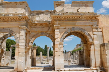 Fototapeta na wymiar Gate of ancient Ephesus city Agora. Izmir, Turkey. It was built in the 2nd century BC.