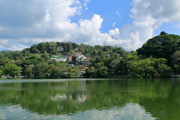 Fototapeta na wymiar Kandy, Sri Lanka - Kandy Lake and a view from the city. The famous tooth temple is in this city. It is also the old capital of Sri Lanka.