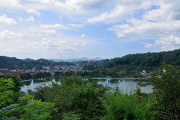 Fototapeta premium Kandy, Sri Lanka - Kandy Lake and a view from the city. The famous tooth temple is in this city. It is also the old capital of Sri Lanka.