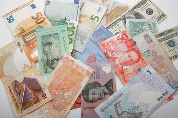 View of composition with various world banknotes.