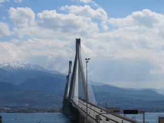 View of the Rio-Antirrio Bridge, officially the Charilaos Trikoupis Bridge, located in Greece on a cloudy day