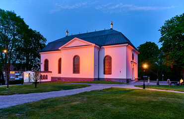 Vaxholm's illuminated and beautiful church one summer evening