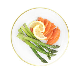 Tasty asparagus with salmon and lemon isolated on white, top view