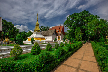 Background of an important tourist attraction in Khon Kaen, where tourists come to see the beauty always (Phra That Kham Kaen) is an old pagoda and has a beautiful golden yellow color, in Thailand