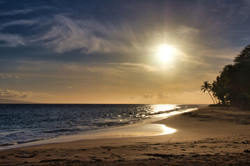 Naklejka na ściany i meble Tropical sunset at a sandy beach on Maui.