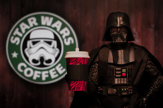 NEW YORK USA, JUNE 21 2020: Humorous image of Star Wars Darth Vader with a coffee drink and a Star Wars Coffee sign - Hasbro action figure
