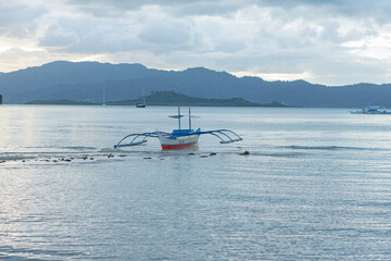 Panoramic scene, boat on beach in Philippines, Port Barton