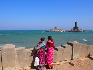 Indian women looking at the sea from the southernmost tip of India, Kanyakumari, Tamil Nadu, South India, India