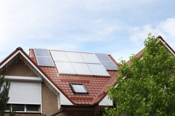 Naklejka premium House with installed solar panels on roof