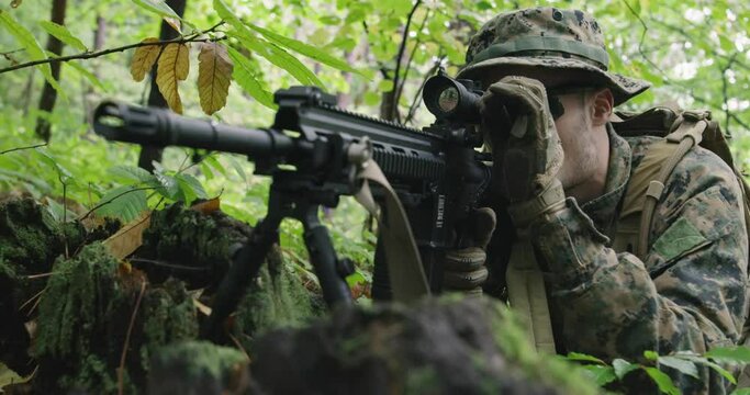 Soldiers or private military contractors aiming with rifle. war, army, weapon, technology and people concept