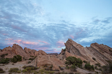 red rocks and blue sky with pink clouds in Vasquez Rocks, California
