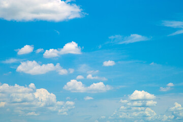 White fluffy clouds in the blue sky in clearly day
