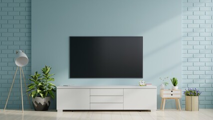 Smart TV on the blue wall in living room,minimal design.