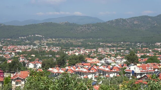 Ovacik, Fethiye, Turkey - 11th of Jane 2020: 4K Zoom in Ovacik village sinking in the beautiful nature
