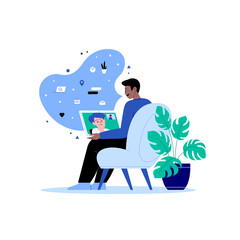 A man staying home talking with a woman via video call sitting on the chair