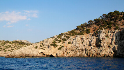 Fototapeta premium Symi island, rocky seashore, the Aegean Sea, Greece