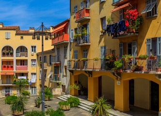 Fototapeta na wymiar Old traditional houses and a courtyard in the Old Town Vielle Ville in Nice in the South of France