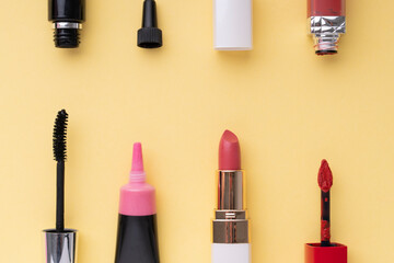 Obraz premium Top view. Flat lay. Cosmetic make up tools set collection over bright yellow background.