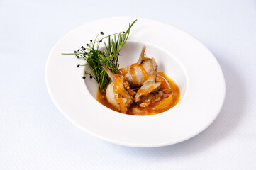 A plate of quail on a white background