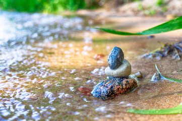 Small stack of pebbles or stones in a stream