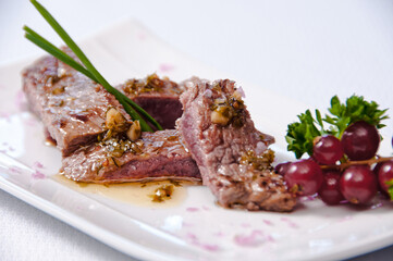 A plate of meat on a white background