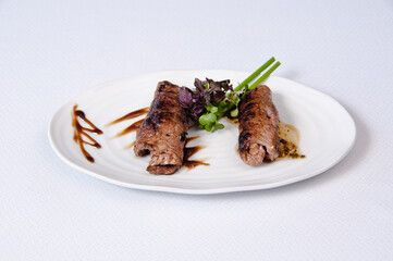 A plate of meat on white a background