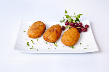 Croquettes plate on a white background