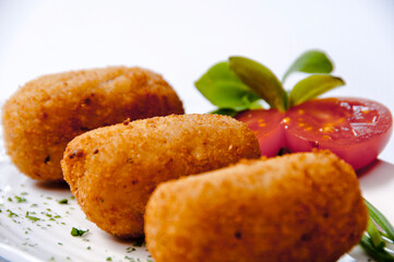 Croquettes plate on a white background
