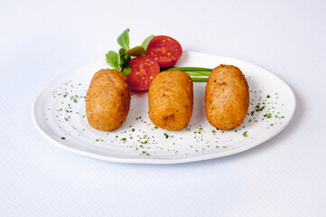 Croquettes plate on a white background