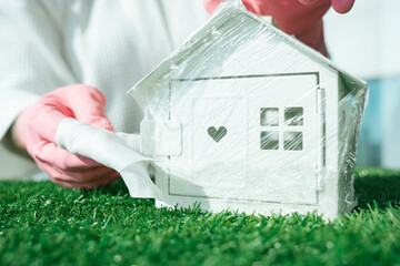 Covid-19 concept. Doctor try to save people in the house.