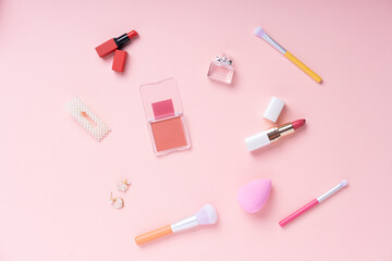 Cosmetic pink collection set on bright pink background.