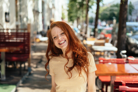 Attractive young redhead woman with a lovely smile
