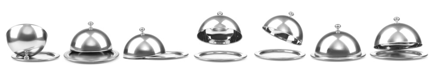 Trays with cloches on white background