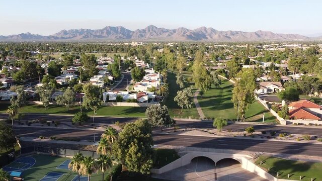 Aerial footage of Scottsdale, Arizona with McDowell Mountains in the horizon.