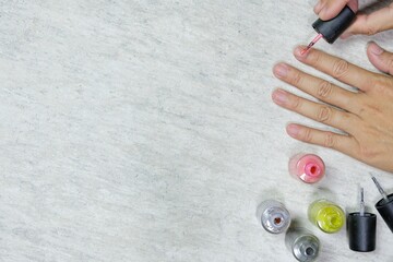 Nail painting work by hand, top view