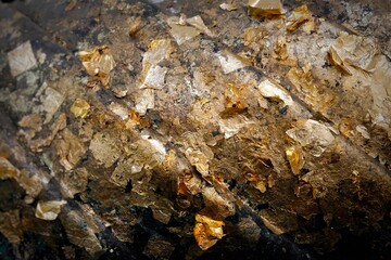 Blurred image of the Buddha image covered with gold leaf