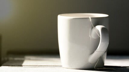 white cup on a table
