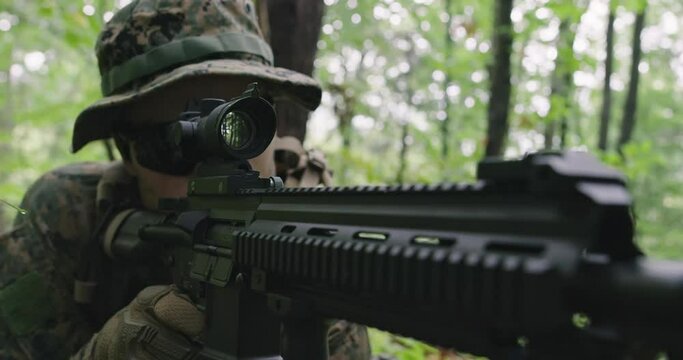 Soldiers or private military contractors aiming with rifle. war, army, weapon, technology and people concept